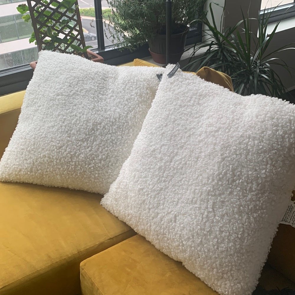 24x24 white Boucle throw pillows. 100% polyester, the back is 83% rayon 17%linen